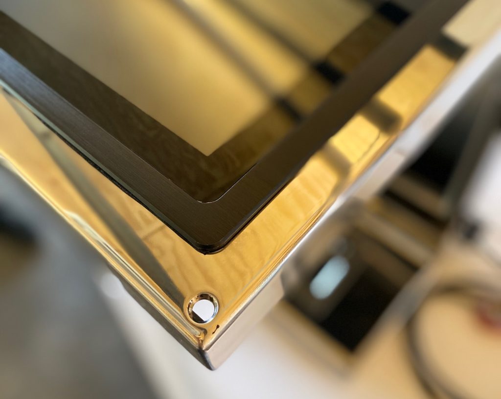 Close-up of Brandwagon stainless steel kiosk corner with touchscreen frame